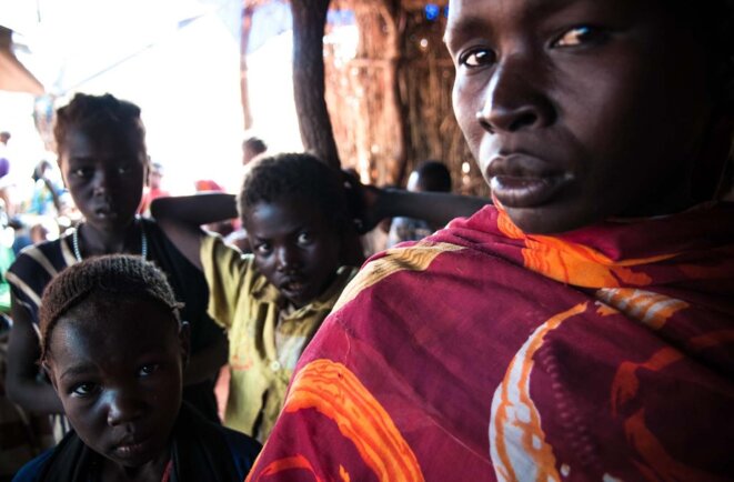 Adia et ses six enfants arrivent au camp de réfugiés de Yida (Sud Soudan) © James Keogh/Wostok Press Adia et ses six enfants arrivent au camp de réfugiés de Yida (Sud Soudan) © James Keogh/Wostok Press